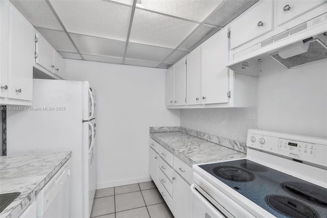 251 174th St Unit 2115, Sunny Isles Beach, FL 33160 - kitchen featuring white appliances, under cabinet range hood, a paneled ceiling, light countertops, and white cabinetry