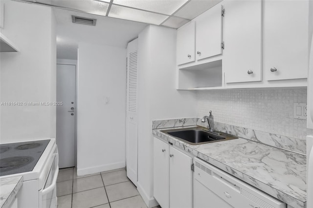 251 174th St Unit 2115, Sunny Isles Beach, FL 33160 - kitchen featuring white appliances, a sink, white cabinetry, and tasteful backsplash