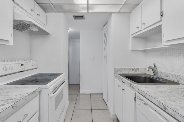 251 174th St Unit 2115, Sunny Isles Beach, FL 33160 - kitchen featuring white appliances, a sink, decorative backsplash, and white cabinetry