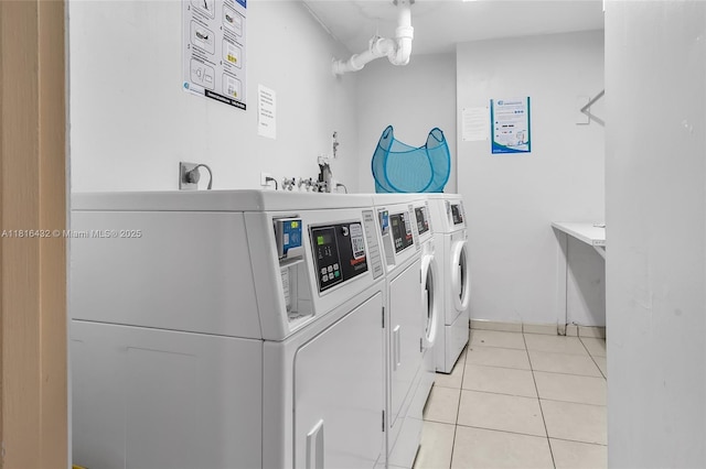 251 174th St Unit 2115, Sunny Isles Beach, FL 33160 - shared laundry room with independent washer and dryer and light tile patterned floors