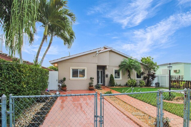 6710 SW 33rd St, Miami, FL 33155 - bungalow-style house featuring a gate and stucco siding
