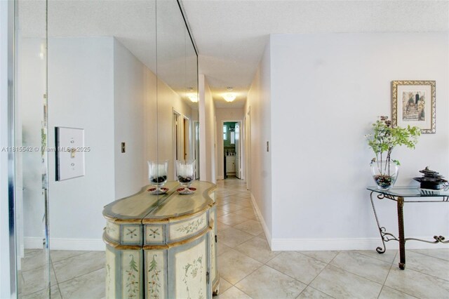 6710 SW 33rd St, Miami, FL 33155 - hallway featuring baseboards and light tile patterned floors