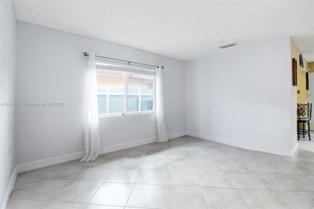 6710 SW 33rd St, Miami, FL 33155 - spare room with light tile patterned floors and baseboards