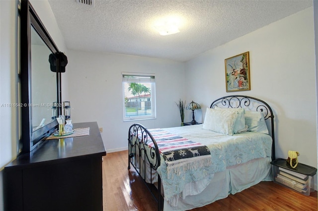 6710 SW 33rd St, Miami, FL 33155 - bedroom featuring wood finished floors and a textured ceiling