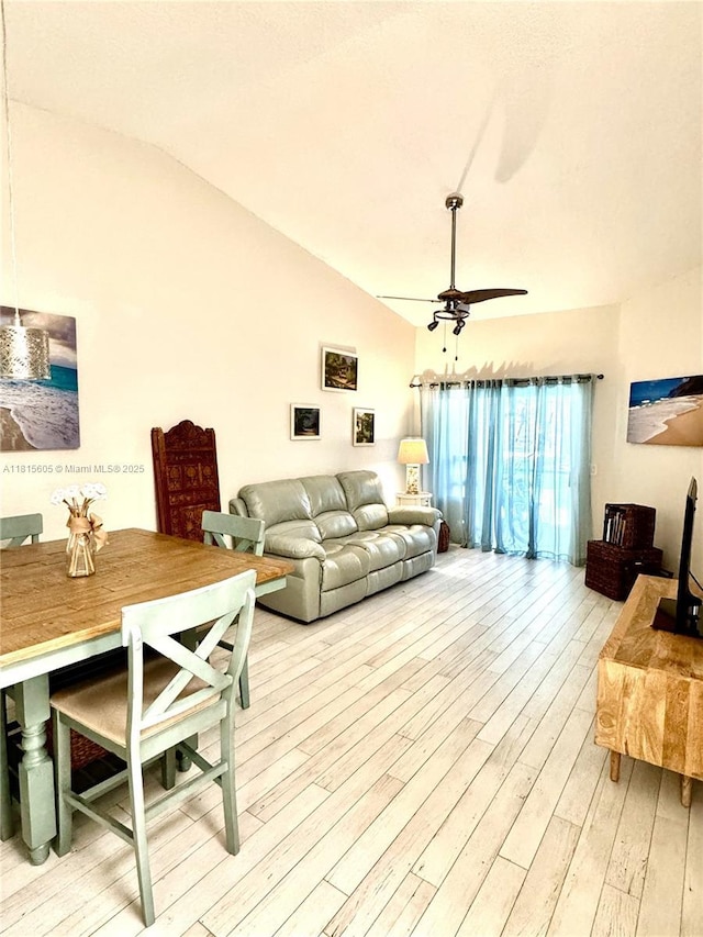 729 NW 47th St, Deerfield Beach, FL 33064 - living room featuring lofted ceiling, light wood-style flooring, and ceiling fan