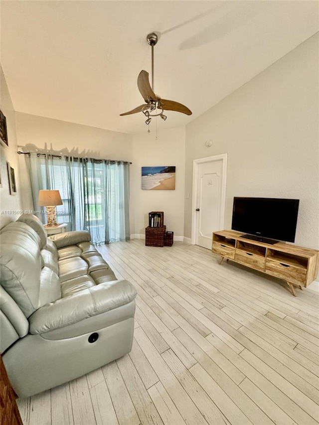 729 NW 47th St, Deerfield Beach, FL 33064 - living area with lofted ceiling, hardwood / wood-style floors, ceiling fan, and baseboards
