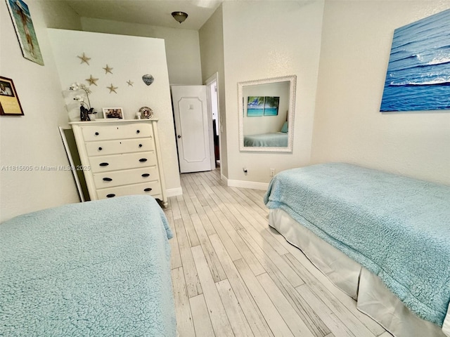 729 NW 47th St, Deerfield Beach, FL 33064 - bedroom with light wood-style flooring and baseboards