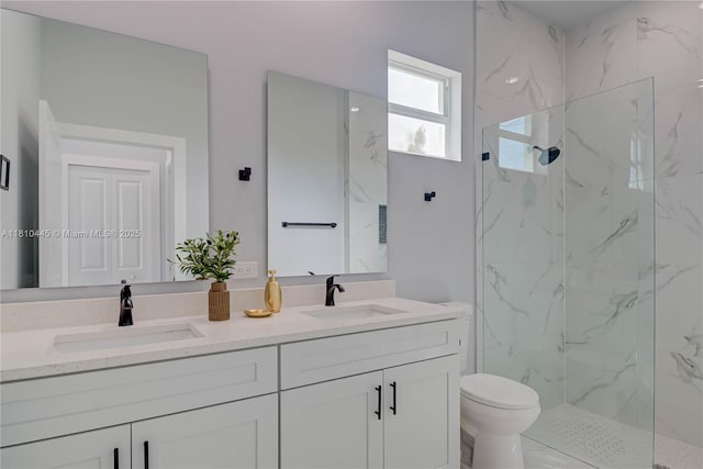 3121 71st St W, Lehigh Acres, FL 33971 - bathroom with double vanity, a marble finish shower, and toilet
