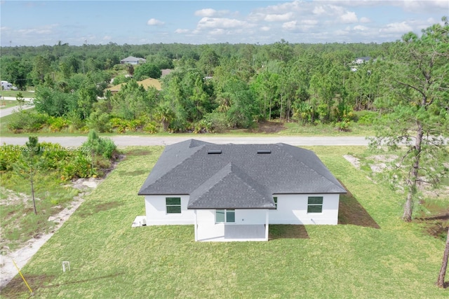 3417 71st St W, Lehigh Acres, FL 33971 - aerial view of property and surrounding area with a forest