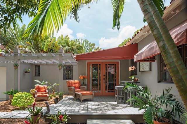 492 NE 55th St, Miami, FL 33137 - wooden deck featuring french doors