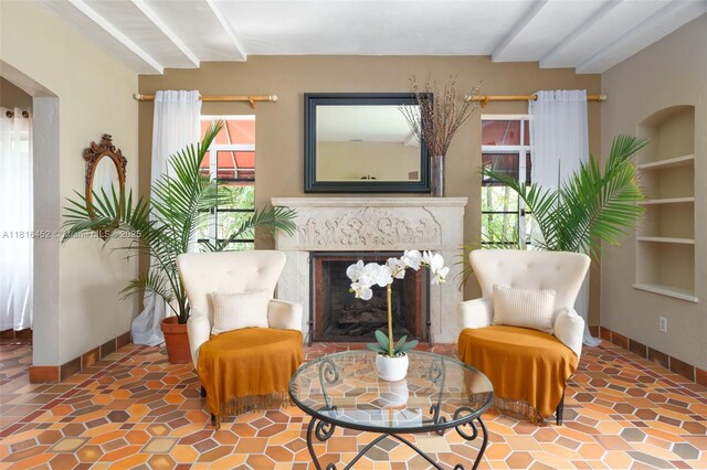 492 NE 55th St, Miami, FL 33137 - living area with baseboards, a high end fireplace, and built in shelves