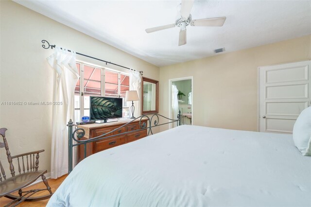 492 NE 55th St, Miami, FL 33137 - bedroom featuring wood finished floors and a ceiling fan