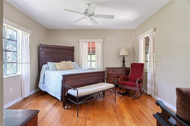492 NE 55th St, Miami, FL 33137 - bedroom featuring multiple windows, light wood-style flooring, and baseboards