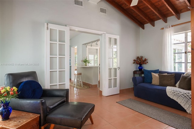492 NE 55th St, Miami, FL 33137 - living room with wooden ceiling, light tile patterned flooring, french doors, and a ceiling fan