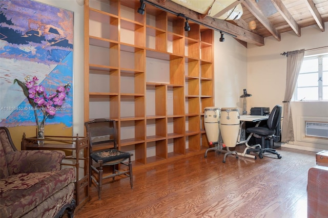 492 NE 55th St, Miami, FL 33137 - office area with wood finished floors, wood ceiling with exposed beams, track lighting, and a wall unit AC