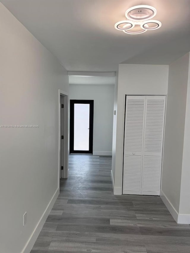 2160 NW 30th St, Miami, FL 33142 - hallway featuring baseboards and wood finished floors