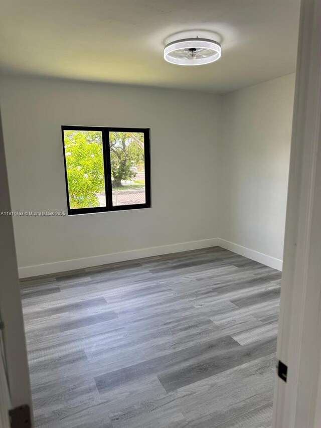 2160 NW 30th St, Miami, FL 33142 - empty room with wood finished floors