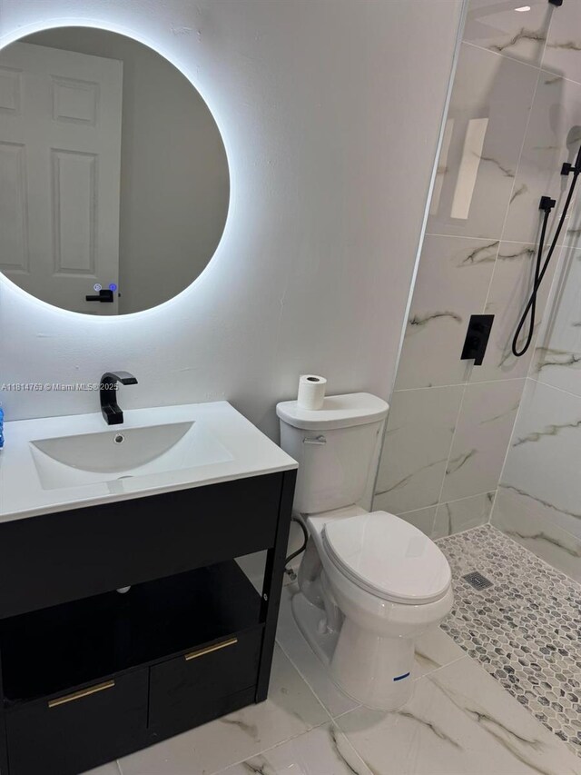 2160 NW 30th St, Miami, FL 33142 - full bath featuring healthy amount of natural light, vanity, marble look tile flooring, and a marble finish shower