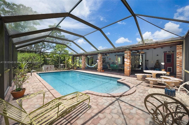 9728 SW 135th Ter, Miami, FL 33176 - outdoor pool featuring a patio area, ceiling fan, and glass enclosure