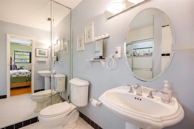 9728 SW 135th Ter, Miami, FL 33176 - full bath with a sink, toilet, a ceiling fan, ensuite bathroom, and tile patterned flooring