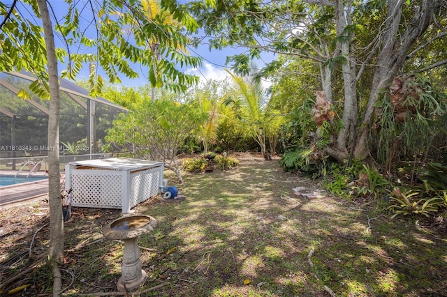 9728 SW 135th Ter, Miami, FL 33176 - view of yard with an outdoor pool and a lanai