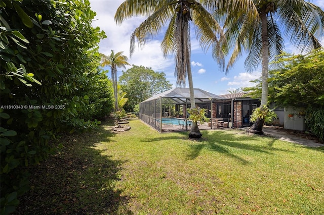 9728 SW 135th Ter, Miami, FL 33176 - view of grassy yard featuring an outdoor pool and a lanai