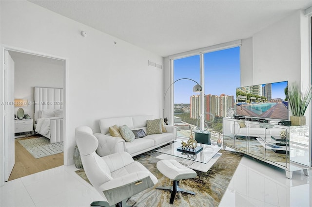 150 Sunny Isles Blvd Unit 1-1803, Sunny Isles Beach, FL 33160 - living room featuring wood finished floors and a wall of windows