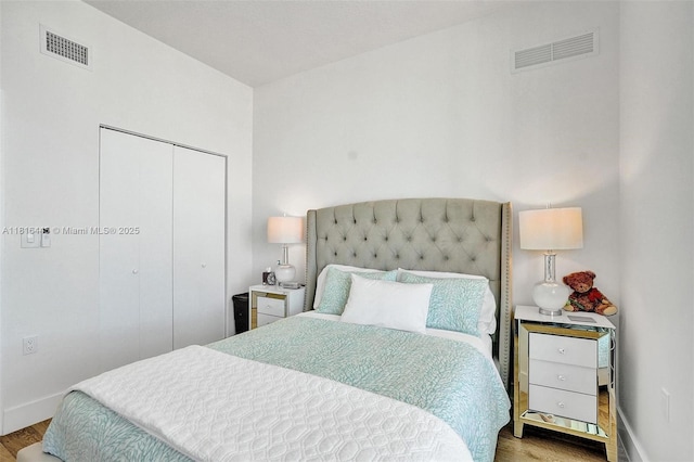 150 Sunny Isles Blvd Unit 1-1803, Sunny Isles Beach, FL 33160 - bedroom featuring wood finished floors, baseboards, and a closet