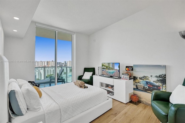 150 Sunny Isles Blvd Unit 1-1803, Sunny Isles Beach, FL 33160 - bedroom with light wood-style flooring, access to exterior, expansive windows, and recessed lighting