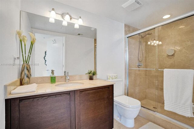 150 Sunny Isles Blvd Unit 1-1803, Sunny Isles Beach, FL 33160 - bathroom featuring vanity, toilet, a stall shower, and tile patterned floors