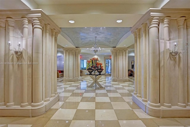 150 Sunny Isles Blvd Unit 1-1803, Sunny Isles Beach, FL 33160 - corridor with decorative columns, lofted ceiling, a chandelier, and recessed lighting