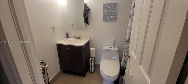 5773 Washington St Unit J2, Hollywood, FL 33023 - bathroom with vanity, toilet, tile patterned flooring, and baseboards