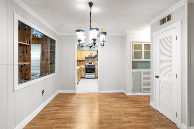 4878 NW 2nd Ct, Plantation, FL 33317 - unfurnished dining area featuring a chandelier, light wood finished floors, ornamental molding, and baseboards