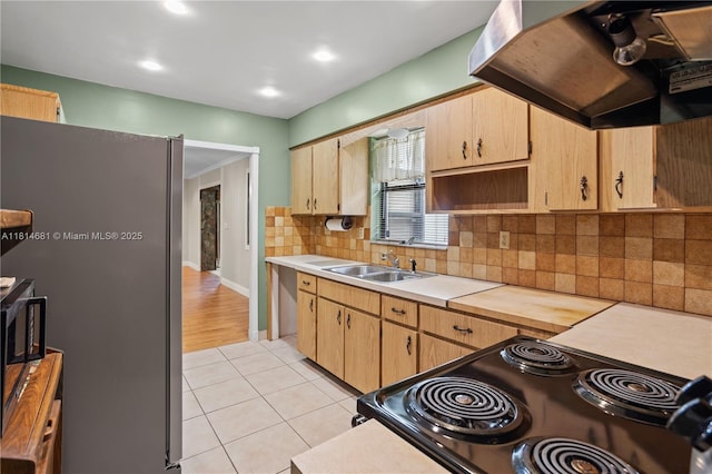 4878 NW 2nd Ct, Plantation, FL 33317 - kitchen featuring freestanding refrigerator, premium range hood, light countertops, a sink, and light tile patterned flooring