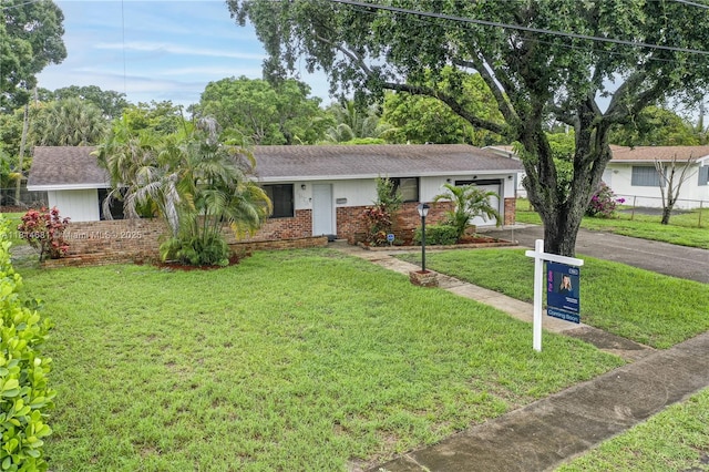 4878 NW 2nd Ct, Plantation, FL 33317 - ranch-style home with brick siding, a garage, driveway, and a shingled roof