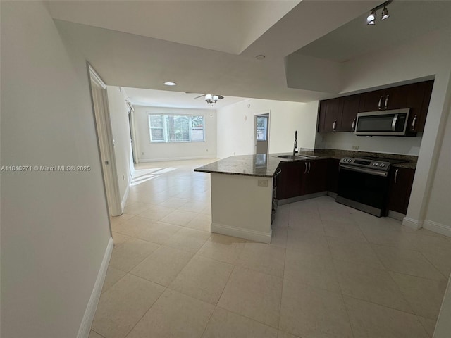 19900 E Country Club Dr Unit 209, Aventura, FL 33180 - kitchen featuring appliances with stainless steel finishes, a sink, a peninsula, open floor plan, and baseboards