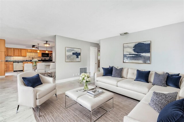 735 NE 38th St, Oakland Park, FL 33334 - living room with baseboards and light marble finish flooring