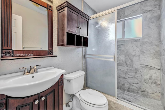 735 NE 38th St, Oakland Park, FL 33334 - bathroom featuring a shower stall, toilet, vanity, and a textured wall