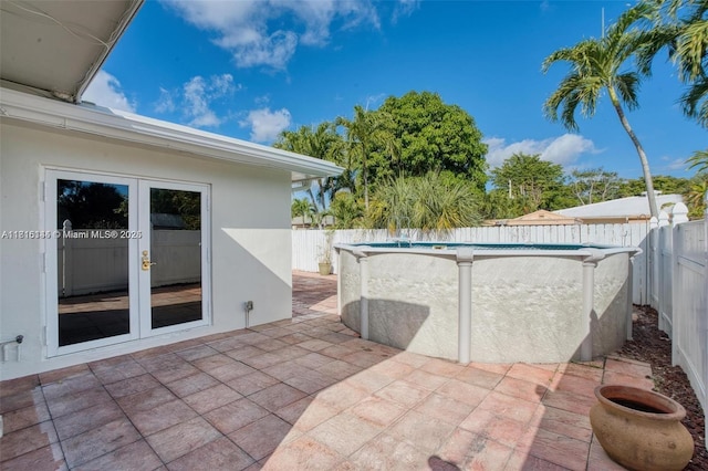 735 NE 38th St, Oakland Park, FL 33334 - fenced backyard with french doors and a patio