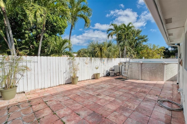 735 NE 38th St, Oakland Park, FL 33334 - fenced backyard featuring a patio