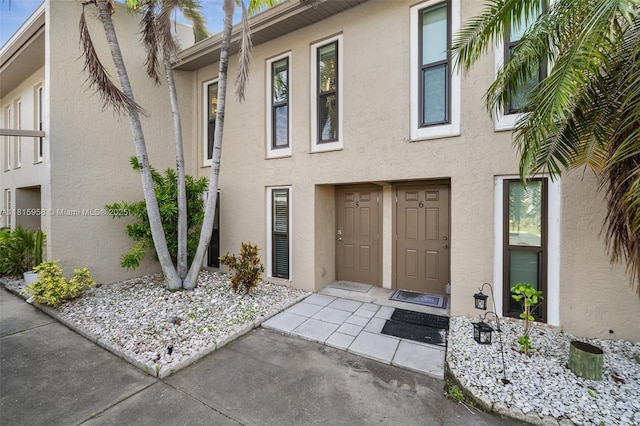 4803 SW Santa Barbara Ct Unit 5, Cape Coral, FL 33914 - view of exterior entry with stucco siding
