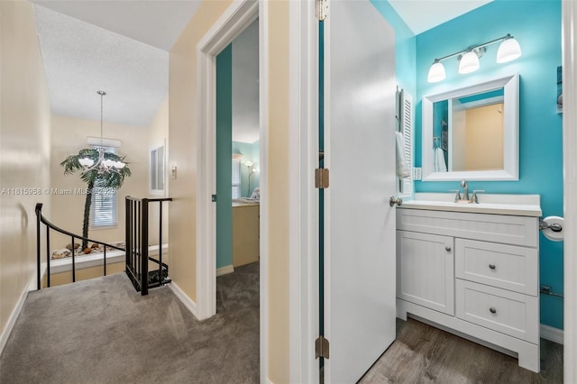 4803 SW Santa Barbara Ct Unit 5, Cape Coral, FL 33914 - hall with an upstairs landing and dark wood-style flooring