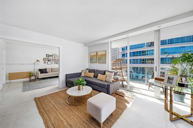 1155 Brickell Bay Dr Unit 3002, Miami, FL 33131 - living room featuring a wall of windows and baseboards