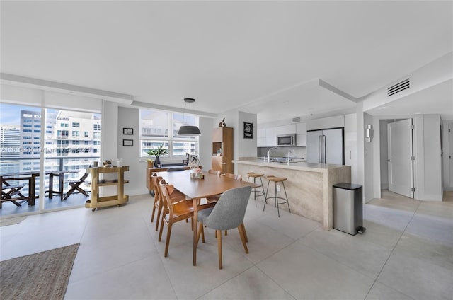 1155 Brickell Bay Dr Unit 3002, Miami, FL 33131 - dining room with light tile patterned floors