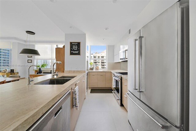 1155 Brickell Bay Dr Unit 3002, Miami, FL 33131 - kitchen featuring appliances with stainless steel finishes, light countertops, modern cabinets, and healthy amount of natural light