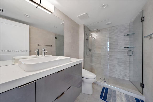 1155 Brickell Bay Dr Unit 3002, Miami, FL 33131 - bathroom featuring tile patterned floors, vanity, and a stall shower