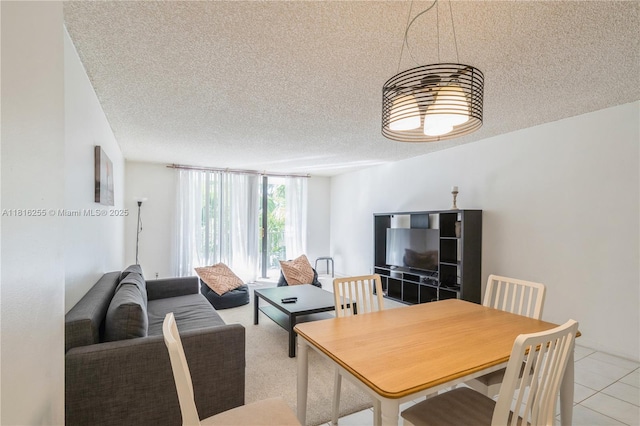 18151 NE 31st Ct Unit 205, Aventura, FL 33160 - dining area with a textured ceiling and light tile patterned flooring