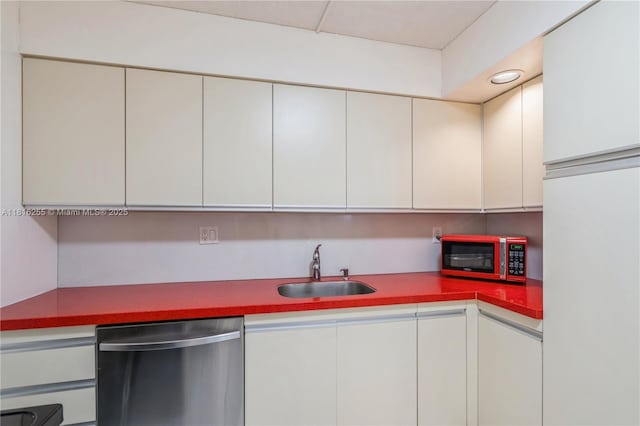 18151 NE 31st Ct Unit 205, Aventura, FL 33160 - kitchen with dishwasher, a sink, and white cabinets