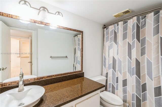 18151 NE 31st Ct Unit 205, Aventura, FL 33160 - full bath featuring vanity, toilet, and a shower with shower curtain