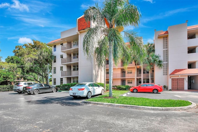 9510 Seagrape Dr Unit 101, Davie, FL 33324 - view of apartment building / complex with uncovered parking